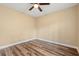 Bedroom featuring wood floor, neutral walls, ceiling fan, and natural light at 177 Reef Run Rd., Pawleys Island, SC 29585