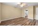 Bedroom showcasing hardwood floors, ceiling fan, and ensuite bathroom access at 177 Reef Run Rd., Pawleys Island, SC 29585