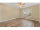 Bright bedroom with hardwood floors, neutral paint, and a window providing natural light at 177 Reef Run Rd., Pawleys Island, SC 29585