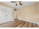 Bedroom featuring wood floor, neutral walls, double closet, and ceiling fan at 177 Reef Run Rd., Pawleys Island, SC 29585