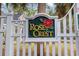 Elegant community sign for 'Rose Crest', set against a backdrop of lush greenery at 177 Reef Run Rd., Pawleys Island, SC 29585