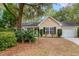 Well-maintained single-story home with a manicured front yard and attached garage at 177 Reef Run Rd., Pawleys Island, SC 29585