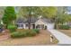 Charming single story home featuring mature trees, a well manicured front yard, and an attached garage at 177 Reef Run Rd., Pawleys Island, SC 29585