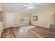 Spacious living room featuring hardwood floors, neutral paint, a ceiling fan, and an open window at 177 Reef Run Rd., Pawleys Island, SC 29585