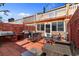 Outdoor brick patio featuring a grill and lounge seating area, perfect for entertaining at 1851 Fairway Ridge # 7C, Surfside Beach, SC 29575