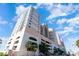 Exterior shot showcasing a tall modern condo building with many windows and garage at 1903 S Ocean Blvd. # 606, North Myrtle Beach, SC 29582