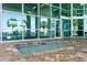 Inviting hot tub with brick surround, adjacent to fitness center and views of the pool at 1903 S Ocean Blvd. # 606, North Myrtle Beach, SC 29582