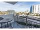 Balcony view shows the property's lush surroundings and comfortable outdoor seating at 2001 S Ocean Blvd. # 418, Myrtle Beach, SC 29577