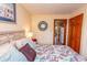 Bedroom boasts a cozy bed, closet, and doorway leading to the kitchen at 2001 S Ocean Blvd. # 418, Myrtle Beach, SC 29577