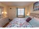 Bedroom with floral bedspread, dresser, and mirror at 2001 S Ocean Blvd. # 418, Myrtle Beach, SC 29577