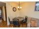 Casual dining area with a marble-top table, comfortable chairs, and a charming chandelier at 2001 S Ocean Blvd. # 418, Myrtle Beach, SC 29577