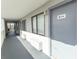 Exterior hallway view showing unit doors, windows, and stucco exterior walls at 2001 S Ocean Blvd. # 418, Myrtle Beach, SC 29577