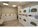 On-site laundry room featuring multiple coin and app-operated washers and dryers for convenience at 2001 S Ocean Blvd. # 418, Myrtle Beach, SC 29577