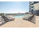 Large pool deck and lounge chairs offer space for residents to relax by the pool at 2001 S Ocean Blvd. # 418, Myrtle Beach, SC 29577