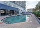 Sparkling pool and lounge area near an outdoor dining space, perfect for relaxation at 2001 S Ocean Blvd. # 418, Myrtle Beach, SC 29577