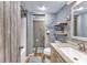 Bathroom featuring gray walls, wood-look floors, a sink, toilet, and tub/shower combo at 201 75Th Ave N # 4094, Myrtle Beach, SC 29572