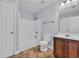 Bright bathroom with tile floor, wood vanity, toilet, and white shower-tub combo at 228 Gresham Ln., Myrtle Beach, SC 29588