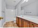 Bright bathroom with tile floors, a white tub, and a vanity with sink at 228 Gresham Ln., Myrtle Beach, SC 29588