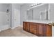 Bathroom with dual sinks, wood cabinets, and combined shower and bathtub at 228 Gresham Ln., Myrtle Beach, SC 29588