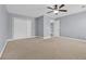 Bedroom features a ceiling fan, carpet, and a double door closet at 228 Gresham Ln., Myrtle Beach, SC 29588