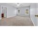 Spacious bedroom with carpet, ceiling fan, and natural light from two windows at 228 Gresham Ln., Myrtle Beach, SC 29588