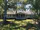 Peaceful backyard view showcasing a screened porch, perfect for outdoor relaxation at 228 Lander Dr., Conway, SC 29526