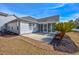 Backyard features a private patio area, mature landscaping, and a screened-in porch at 229 Duchess Ct., Myrtle Beach, SC 29588