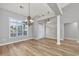 Dining area with hardwood floors, classic chandelier, and views of the home's entry at 229 Duchess Ct., Myrtle Beach, SC 29588