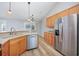 Open kitchen with stainless steel appliances, granite counters, and wood-look flooring at 229 Duchess Ct., Myrtle Beach, SC 29588