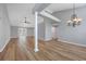 Open-concept living room with a large support beam and wood-look floors throughout at 229 Duchess Ct., Myrtle Beach, SC 29588