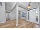 Bright and airy living room featuring wood-look floors and elegant lighting fixtures at 229 Duchess Ct., Myrtle Beach, SC 29588