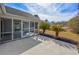 Private patio with tropical landscaping, leads to a screened in porch with a view of the backyard at 229 Duchess Ct., Myrtle Beach, SC 29588