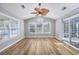 Inviting sun room with wood floors, large windows, and sliding glass doors at 229 Duchess Ct., Myrtle Beach, SC 29588