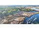 Stunning aerial view showcases a serene marshland, marina, and winding river landscape at 237 Madison Dr., Georgetown, SC 29440