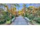 Tree-lined street with a white bridge covered in festive green and red holiday garland at 237 Madison Dr., Georgetown, SC 29440