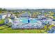 Aerial view of community pool, amenity center, and surrounding neighborhood, highlighting the development's layout and features at 2593 Pegasus Place, Myrtle Beach, SC 29577