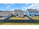 Spacious fenced backyard with a patio, firepit, and seating area, perfect for outdoor living at 2593 Pegasus Place, Myrtle Beach, SC 29577