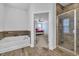 Bathroom featuring a tub and a glass shower, offering options for relaxation and convenience at 2593 Pegasus Place, Myrtle Beach, SC 29577