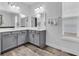 Bright bathroom featuring a large double vanity with modern sinks and tile floors at 2593 Pegasus Place, Myrtle Beach, SC 29577