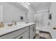 Bright bathroom features a double sink vanity, white tiled shower, and ample space at 2593 Pegasus Place, Myrtle Beach, SC 29577