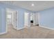 Cozy bedroom featuring multiple doorways and neutral carpeting perfect for creating a comfortable retreat at 2593 Pegasus Place, Myrtle Beach, SC 29577