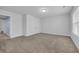 Bedroom with plush carpeting, large window with blinds, double door closet, and neutral paint at 2593 Pegasus Place, Myrtle Beach, SC 29577