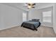 Bedroom with carpeted floors, ceiling fan, and natural lighting at 2593 Pegasus Place, Myrtle Beach, SC 29577