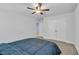 Carpeted bedroom featuring a ceiling fan, double door closet, and natural lighting at 2593 Pegasus Place, Myrtle Beach, SC 29577