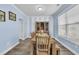 Elegant dining room with wood floors, striped accent wall, and stylish furnishings at 2593 Pegasus Place, Myrtle Beach, SC 29577