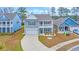 Charming two-story home with a covered porch, manicured lawn, and attached two-car garage at 2593 Pegasus Place, Myrtle Beach, SC 29577