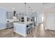 Modern kitchen with gray cabinets, stainless steel appliances, and a large island with bar seating at 2593 Pegasus Place, Myrtle Beach, SC 29577