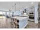 Open-concept kitchen with a large island, stainless appliances, and seamless flow to the living area at 2593 Pegasus Place, Myrtle Beach, SC 29577