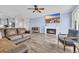 Cozy living room featuring a fireplace, mounted TV, and an open-concept layout into the kitchen at 2593 Pegasus Place, Myrtle Beach, SC 29577