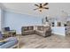 Open-concept living room featuring a comfortable sectional sofa and modern ceiling fan at 2593 Pegasus Place, Myrtle Beach, SC 29577